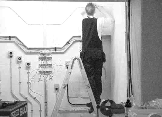 Electrician working at a distribution board